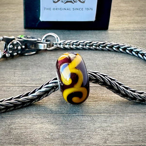 Suzie Q Studio's "ORNAMENT" bead was part of the Trollbeads "Tibet Beads" Collection. This striking bead is a tribute to Tibetan culture. Check out Suzie Q Studio's entire collection of new, never worn Rare & Retired Trollbeads.