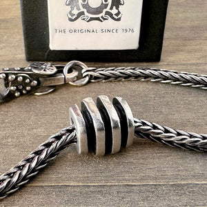 Suzie Q Studio's elegant "CLASSIC" Trollbead is a solid-cast, sterling silver bead in a beautiful classic grooved pattern. Check out Suzie Q Studio's entire collection of new, never worn Rare & Retired Trollbeads.