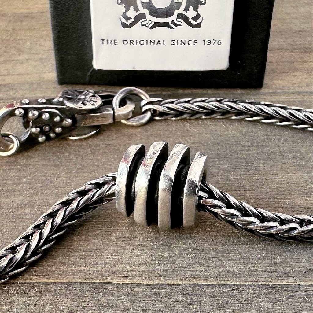 Suzie Q Studio's elegant "CLASSIC" Trollbead is a solid-cast, sterling silver bead in a beautiful classic grooved pattern. Check out Suzie Q Studio's entire collection of new, never worn Rare & Retired Trollbeads.