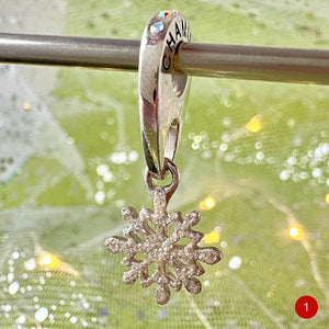 This very rare, enchanting CHAMILIA SNOWFLAKE DANGLE CHARM totally captures the essence of fresh fallen snow. It will fit onto most "bead-on-bracelet" brands, or look magical on a simple necklace chain! Shop online for one-of-a-kind treasures at Suzie Q Studio.