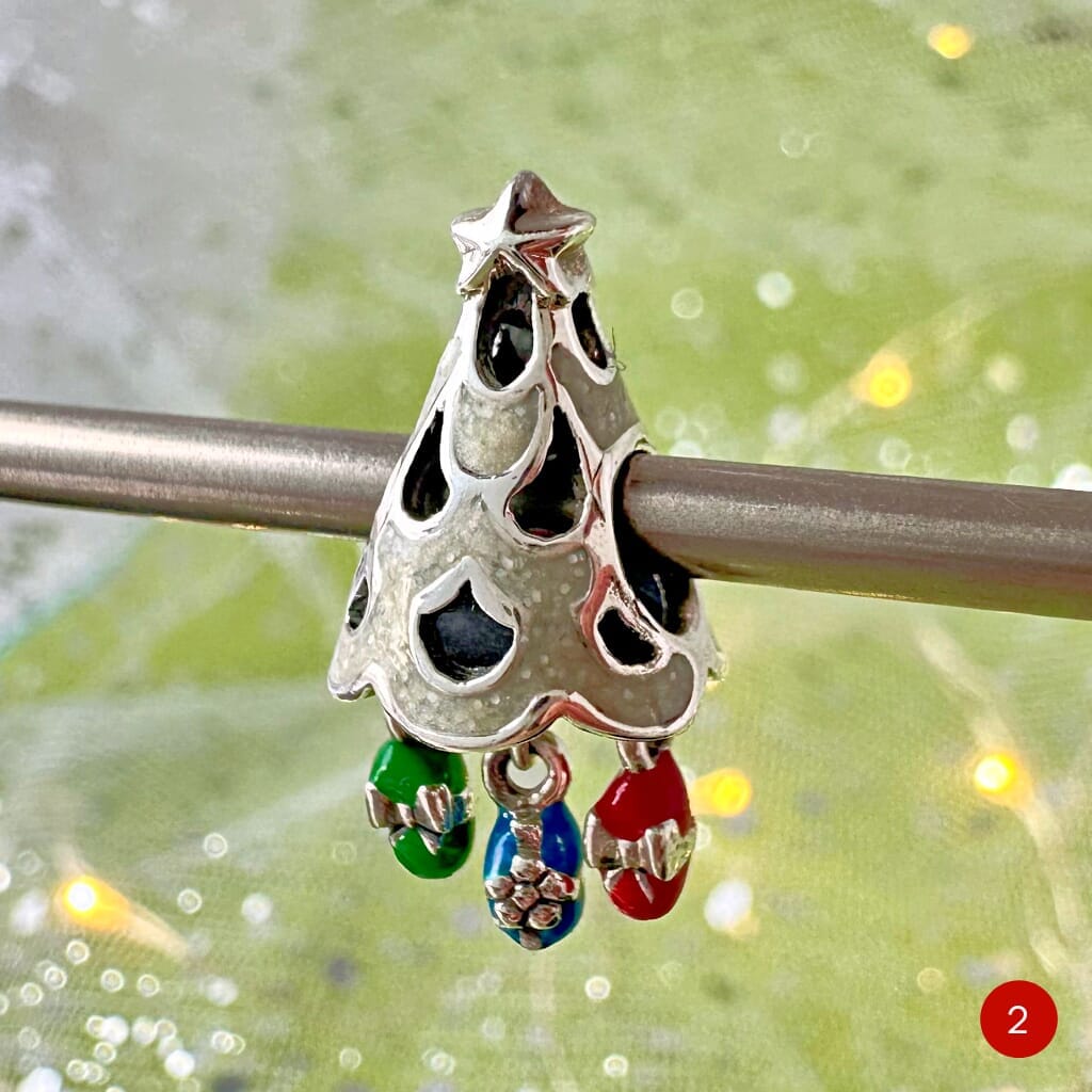 Adorable CHAMILIA CHRISTMAS TREE DANGLE CHARM from Suzie Q Studio: Sterling Silver with colorful presents that dangle. The perfect Christmas or any time gift. Limited quantities available so snap it up quickly.