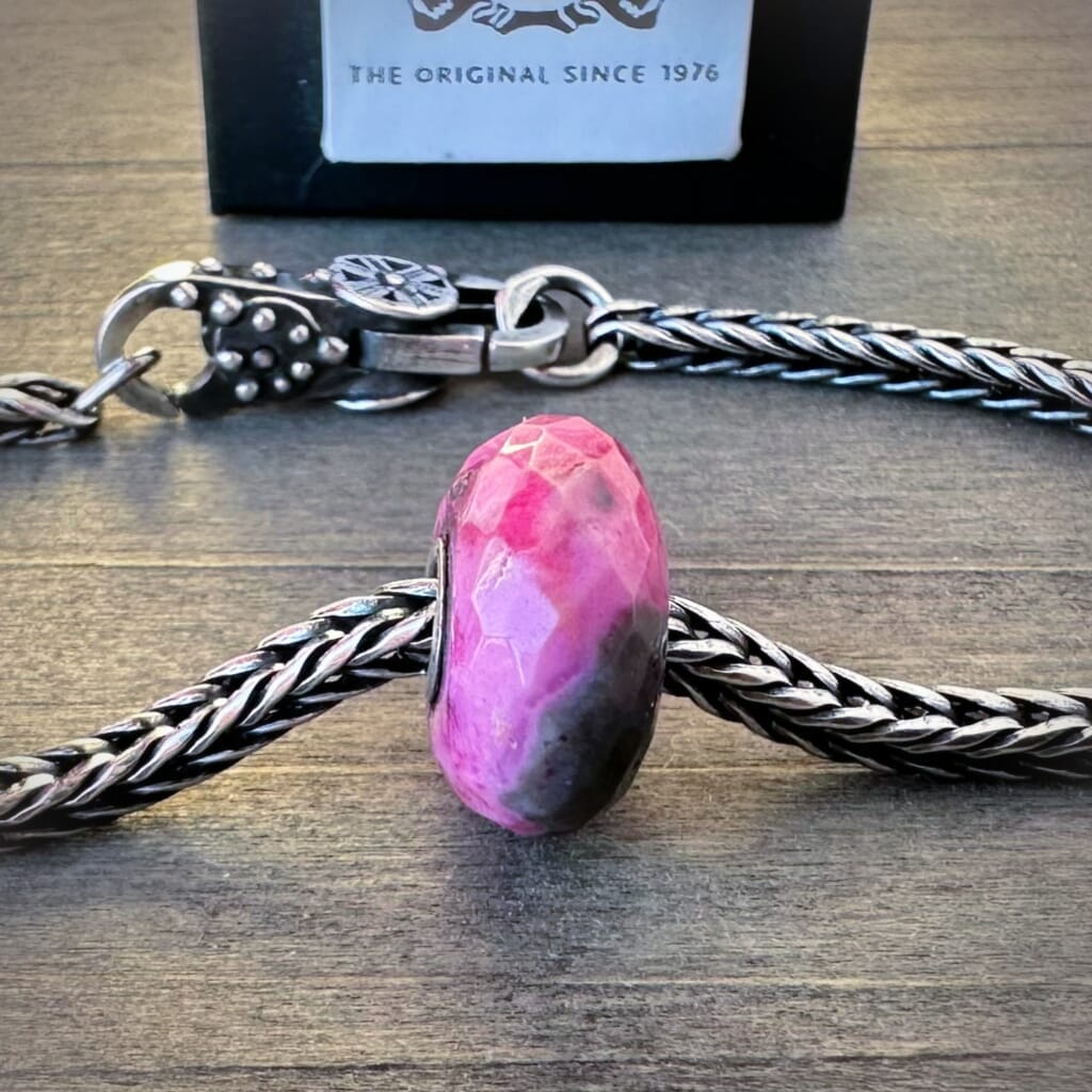 Available at Suzie Q Studio.com, Trollbeads, limited edition, pink, faceted, CRAZY LACE AGATE stone bead, on a silver chain with a clasp.