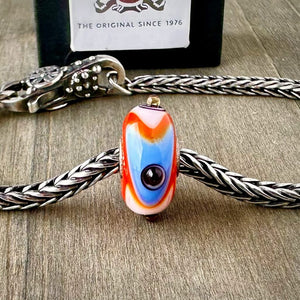 Suzie Q Studio's "Tibet" bead was part of the Trollbeads "Tibet Beads" Collection. This striking bead is a tribute to the colourful Tibetan culture. Check out Suzie Q Studio's entire collection of new, never worn Rare & Retired Trollbeads.