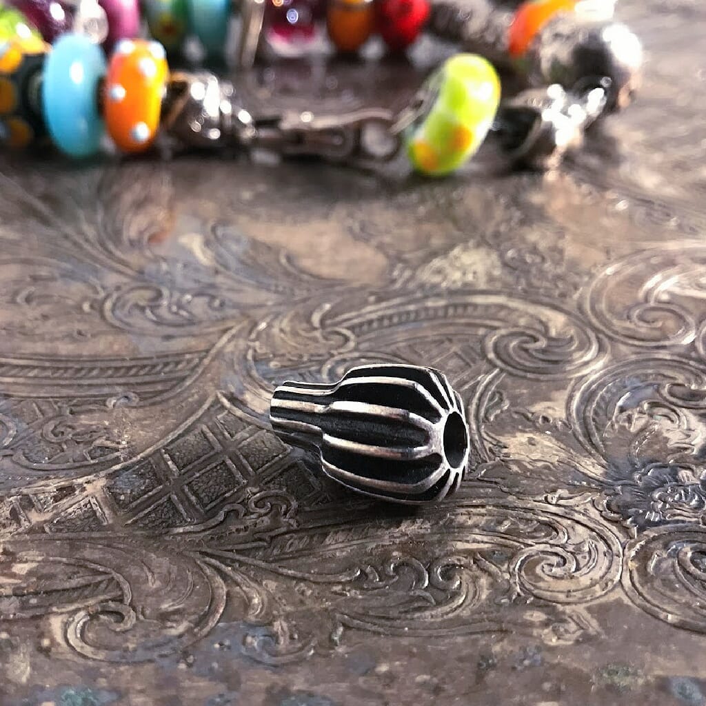 Suzie Q Studio's Trollbeads SILVER FRUIT is an ultra-rare, sterling silver bead that looks like an unusual geometric piece of dynamic fruit.  Be sure to check out Suzie Q Studio's entire collection of new, never worn Rare & Retired Trollbeads.