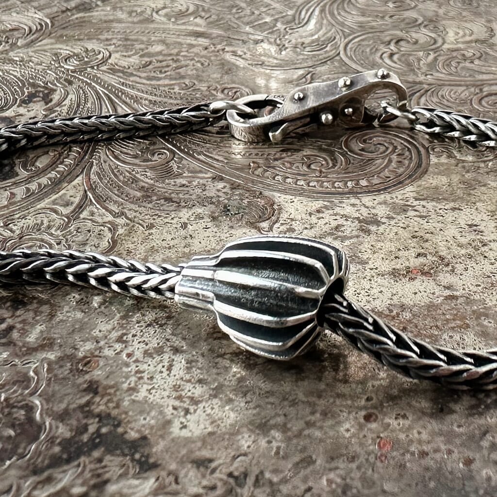 Suzie Q Studio's Trollbeads SILVER FRUIT is an ultra-rare, sterling silver bead that looks like an unusual geometric piece of dynamic fruit.  Be sure to check out Suzie Q Studio's entire collection of new, never worn Rare & Retired Trollbeads.