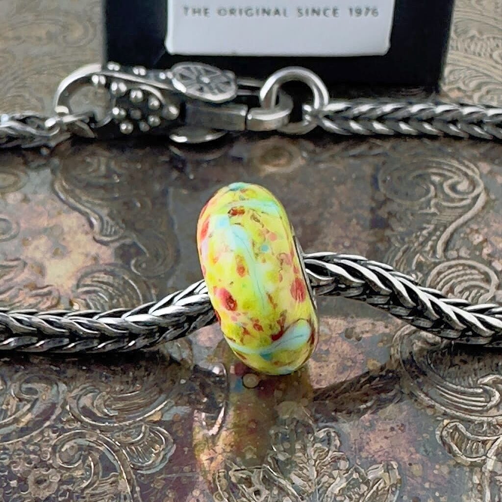 Available at Suzie Q Studio dot com, Trollbeads, rare, one-of-a-kind TROLLSTONE glass bead, on a silver chain with a clasp.